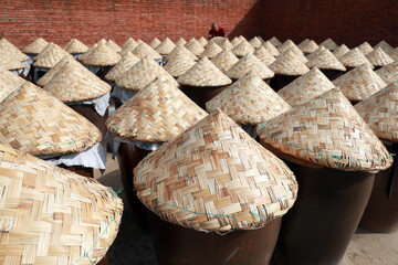 Containers of marinated shrimp oil piled up in the yard, North China