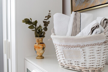 Fototapeta na wymiar clean towels in a basket in hotel room