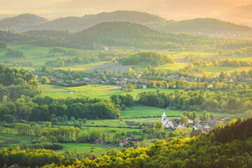 Sudetes, Lower Silesia Poland. Rural landscape made with telephoto lens on sunset 