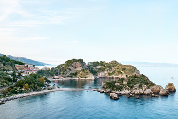 Fototapeta premium Isola Bella island near Taormina, Sicily, Italy Beautiful small island surrounded by azure waters of the Ionian Sea. Beauty in Sicily as a tourist attraction. Season on mediterranean sea.