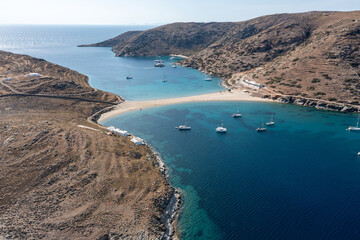 Kolona Fykiada double sided sandy beach, aerial drone view. Greece, Kithnos island, Cyclades.