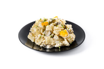 Potato salad with gherkins, egg and mustard isolated on white background