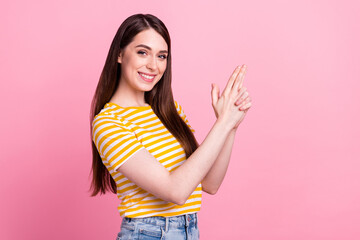Profile photo of crazy young teenager lady show gun wear orange t-shirt isolated on pastel pink color background