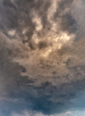 Fantastic clouds at sunrise, vertical panorama