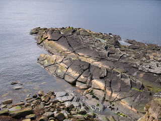 Steeply inclined, fractured rock strata on Sumburgh Head, south Shetland, UK - Hayes Sandstone...