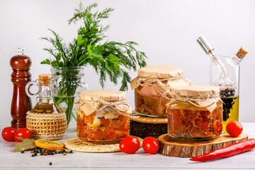 Glass jars with Homemade canned meat from farm poultry-goose, duck, chicken.