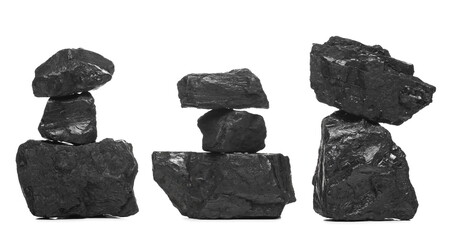 Black coal chunks stacks isolated on white background