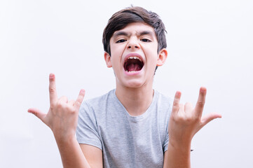 Beautiful child boy student euphoric with backpack on isolated white background