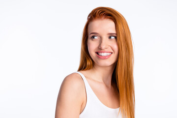 Photo of young cheerful girl happy positive smile dream curious look empty space isolated over grey color background