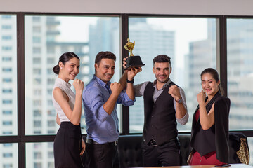 Business team winning trophy in the office, Business People with teamwork in award and successful...
