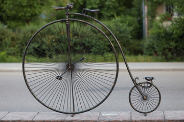 Old bicycle with high wheels  vintage decorative composition