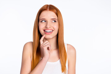 Photo of cheerful red hairdo lady look empty space finger face wear white top isolated on bright...