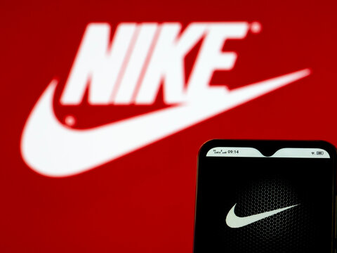 In this photo illustration Nike, Inc. logo seen displayed on a smartphone