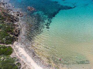 Crystal clear and tropical sea at Del Morto beach, flying with drone, Chia Beach drone