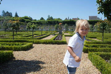 People, family, visiting Villandry gardens in Loire valley on a summer day