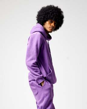 Young Black Man In Set Of Purple Tracksuit