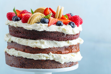Fruity cake with cream on stander