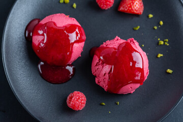 Fruity ice cream scoop on plate