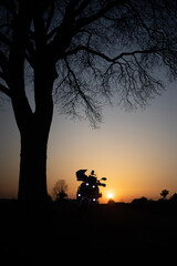 silhouette of a biker