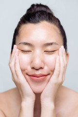 Beautiful young asian woman with clean fresh skin on white background. Asian women portrait.