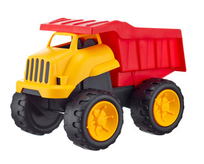 Toy plastic dump truck with a reclining body in bright colors, isolated on a white background. Children's toys. 