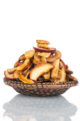 Heap of dry slice apples in a wooden plate. Isolated