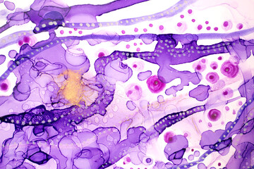 Transparent purple watercolor ink drops and spots abstract background with gold dust.