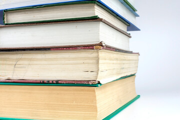 stack of thick books on white background