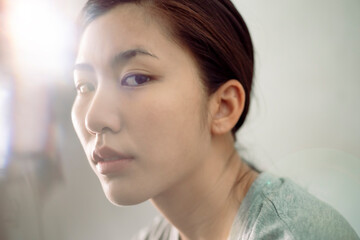 Beautiful young asian woman with clean fresh skin on white background. Asian women portrait.