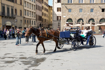 Naklejka na ściany i meble Tourists visiting the sights on the Piazza San Giovanni and del Duomo