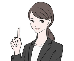 人差し指を立てるスーツの女性