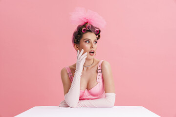 Obraz na płótnie Canvas Young smiling white woman barbie in pink dress