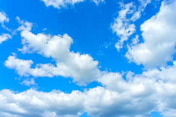 Naklejka na ściany i meble cumulus clouds on a transparent blue sky background