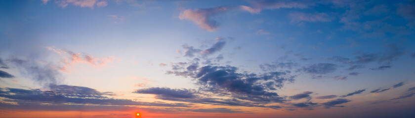 dramatic bright saturated cloudy sunset or sunrise