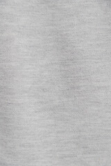 Fototapeta na wymiar Gray fabric texture. Clothes background. Close up