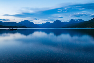 Fototapeta na wymiar tranquil Lake Mc Donald in a clear summers day in Glacier National park in Montana.
