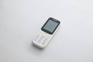 White handphone on white board, White table