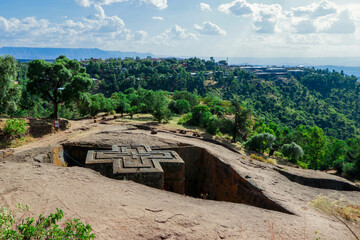 Main View to the Church of Saint George, one of many churches hewn into the rocky hills of...