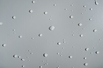Water drops on gray background. Copy space.
