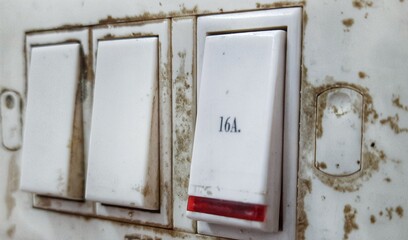Electric switch button. Dirty switch button. Switch to turn on lights, fan, guizer, etc