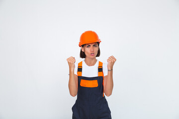 Pretty woman engineer in building protective helmet on white background angry swears at workers