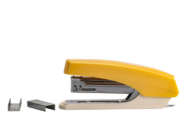Side view of yellow stapler and row of spare staples isolated on white background with clipping...