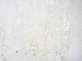 Old wall texture with peeling white paint background. Close up.