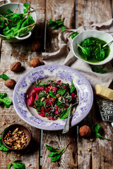 Beet pasta with spinach pesto .style rustic