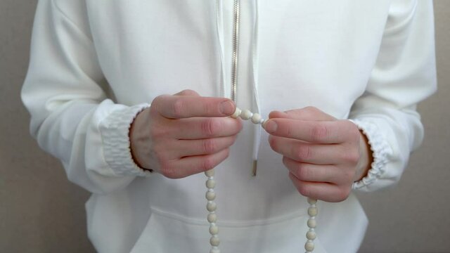 Meditation on the beads close-up. Gapa meditation on the rosary.