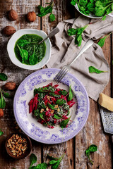 Beet pasta with spinach pesto .style rustic