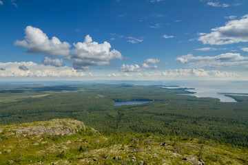 Fototapeta premium View from the mountain to the forest, river and lake. Karelia, Russia.