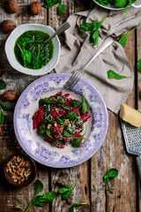Beet pasta with spinach pesto .style rustic
