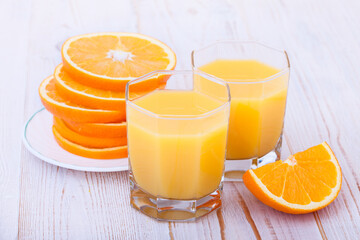 Orange fruit and juices isolated on white background.