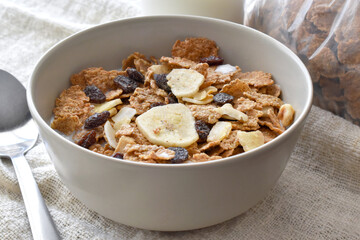 Fruit and fiber cereal with milk in a bowl.  The concept of healthy breakfast, healthy food, dietary plan and weight loss program.